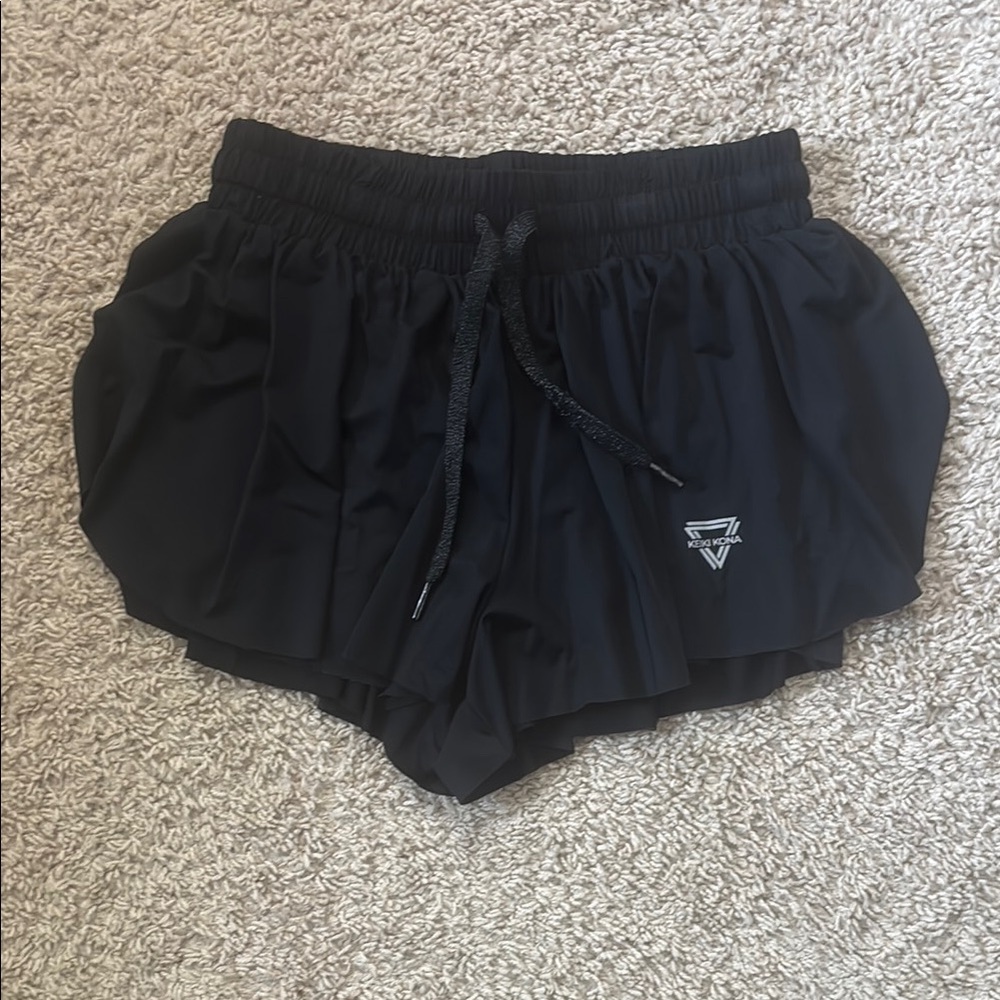 Black Athletic Shorts with Elastic Waistband and Curved Hem